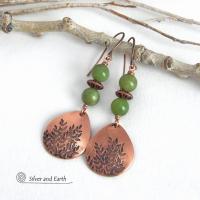These handcrafted earrings feature teardrop shaped copper dangles with a hand-stamped leaf texture accented with natural green jade gemstones and copper beads. They have an earthy, modern style that coordinates well with all wardrobe styles. They'll make a great gift for a nature lover - or a nice addition to your own jewelry wardrobe. Your choice of copper ear wires or niobium hypoallergenic ear wires. Earrings are handmade in the USA by Silver and Earth Jewelry. 