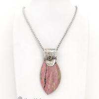 This one-of-a-kind necklace features a large gorgeous rhodonite gemstone accented with a handcrafted sterling silver bail. The stone has a beautiful pink hue with a natural matrix pattern of black, white and tan lines. Coordinating earrings sold separately. Makes a great gift for a natural stone lover - or a nice addition to 