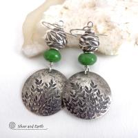 These artisan handcrafted sterling silver earrings have a beautifully detailed hand stamped leaf design. Green serpentine gemstones and pewter beads were added as an accent. The beads have a beautifully detailed 3-dimensional carved pattern of vines and leaves. They have a modern, earthy and elegant style that coordinates beautifully with all wardrobe types. They'll make a great gift for a nature lover - or a nice addition to your own jewelry wardrobe.