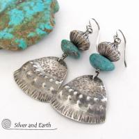These handcrafted earrings feature uniquely textured sterling silver accented with natural turquoise gemstones and oxidized sterling silver beads with a rich, corrugated texture. They have a modern, southwestern tribal flair that makes a bold statement. Handmade in the USA by Silver and Earth Jewelry, a New Mexico True Certified business. 