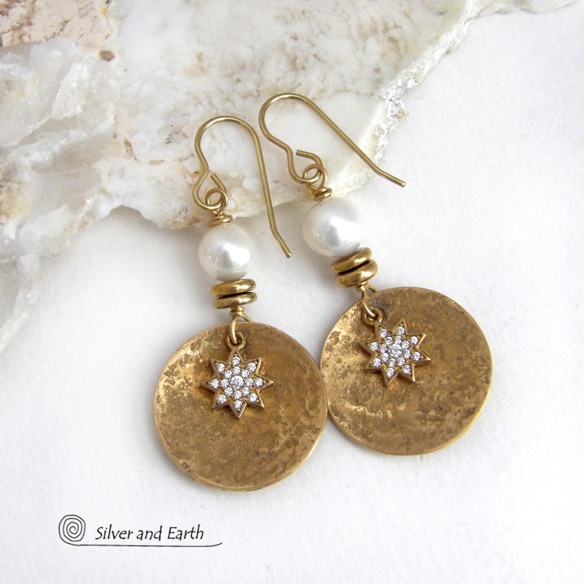 These handcrafted earrings feature gold brass dangles accented with star shaped brass charms with sparkly cubic zirconia crystals. White freshwater pearls and tiny brass beads were added as an accent. They have a classic modern chic style that coordinates beautifully with all wardrobe types - dressed up or down. Makes a great gift for couples celebrating their 21st or 30th anniversary. Brass is the the traditional choice for a 21st anniversary and pearls for a 30th anniversary. 