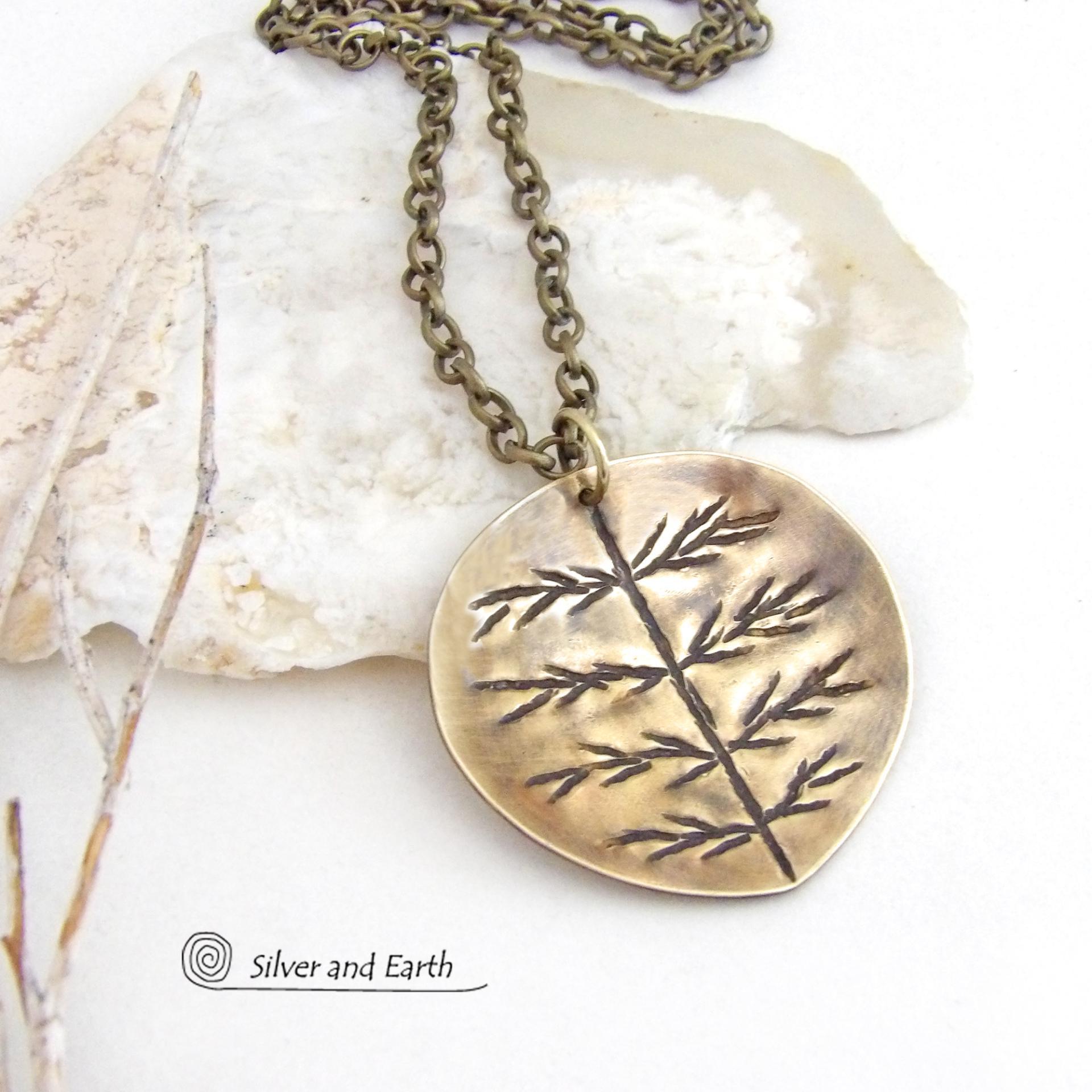 The perfect gift for nature lovers. This artisan handcrafted gold brass leaf pendant necklace has a modern earthy charm. It features a hand stamped texture pattern and comes on an 18" antiqued gold brass chain with lobster claw closure.