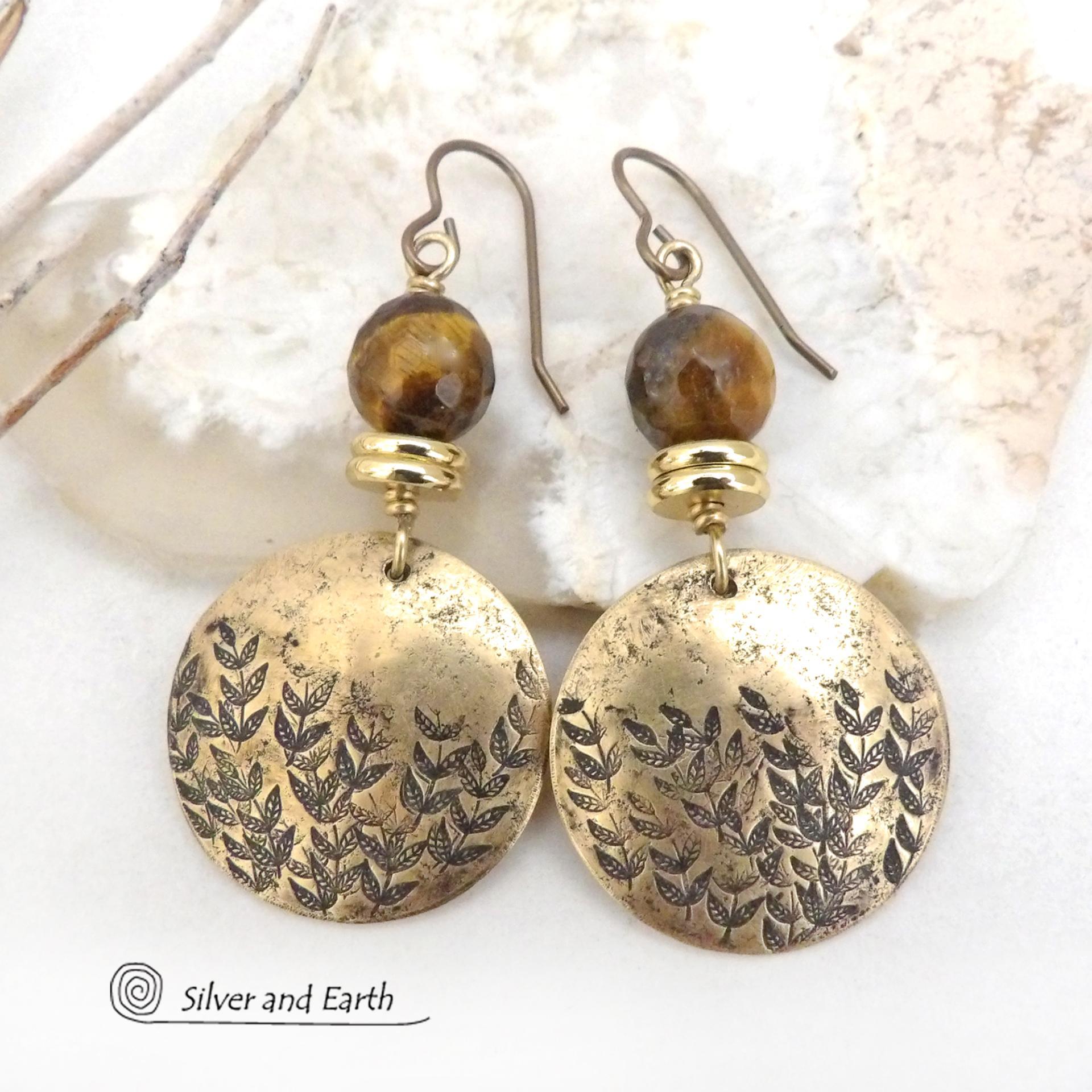 These handcrafted gold brass earrings feature a hand stamped leaf design and are accented with faceted tiger's eye gemstones and brass beads. They have an earthy, modern and elegant style that coordinates beautifully with all wardrobe types. They'll make a great gift for a nature lover - or a nice addition to your own jewelry wardrobe.
