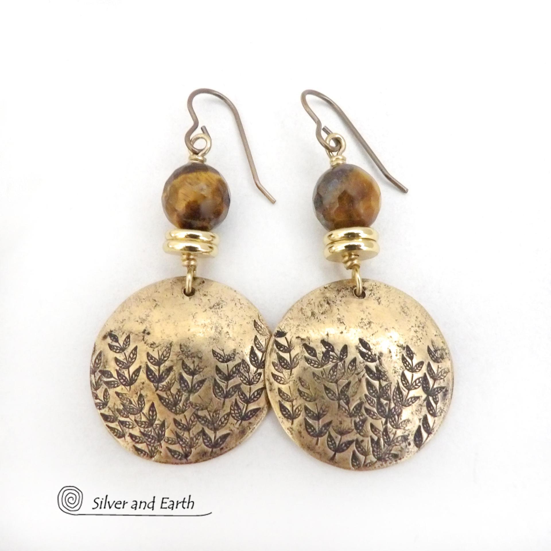 These handcrafted gold brass earrings feature a hand stamped leaf design and are accented with faceted tiger's eye gemstones and brass beads. They have an earthy, modern and elegant style that coordinates beautifully with all wardrobe types. They'll make a great gift for a nature lover - or a nice addition to your own jewelry wardrobe. These artisan-made earrings are perfect for adding a touch of earthy modern style to any outfit. 