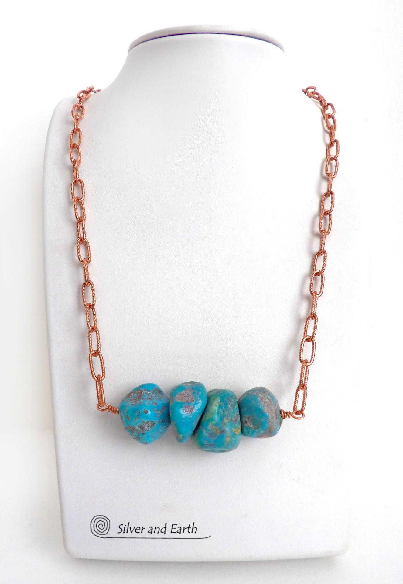 This chunky turquoise necklace features big, organically-shaped nuggets of genuine natural turquoise accented with a copper link chain. The turquoise is a stunning shade of blue - reminiscent of the lovely blue skies here in the American Southwest. Unique and one-of-a-kind, it will make a bold statement. Perfect for women that love bold unique jewelry made with natural stones. Handmade in the USA by Silver and Earth Jewelry. 