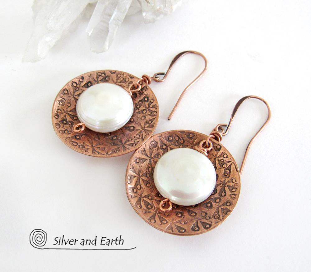 Artisan handcrafted copper earrings with a feminine, elegant style accented with white freshwater coin shaped pearls. Perfect for all occasions, they'll look great dressed up or down. Makes a great gift for couples celebrating their seventh wedding anniversary, as copper is the traditional choice for this occasion. 