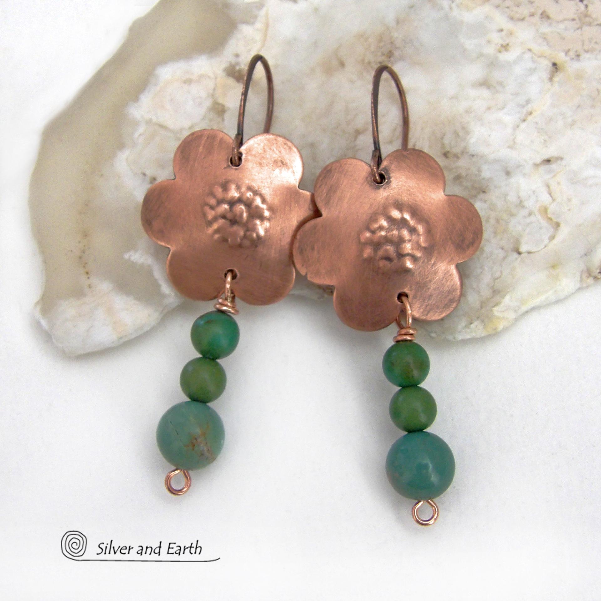 These hand forged copper flower earrings are accented with a stack of dangling turquoise stones. They have an earthy, whimsical charm and will make a great gift for nature / flower lovers and couples celebrating their seventh wedding anniversary. Copper is the traditional choice for this anniversary. Handmade in the USA by Silver and Earth Jewelry. 