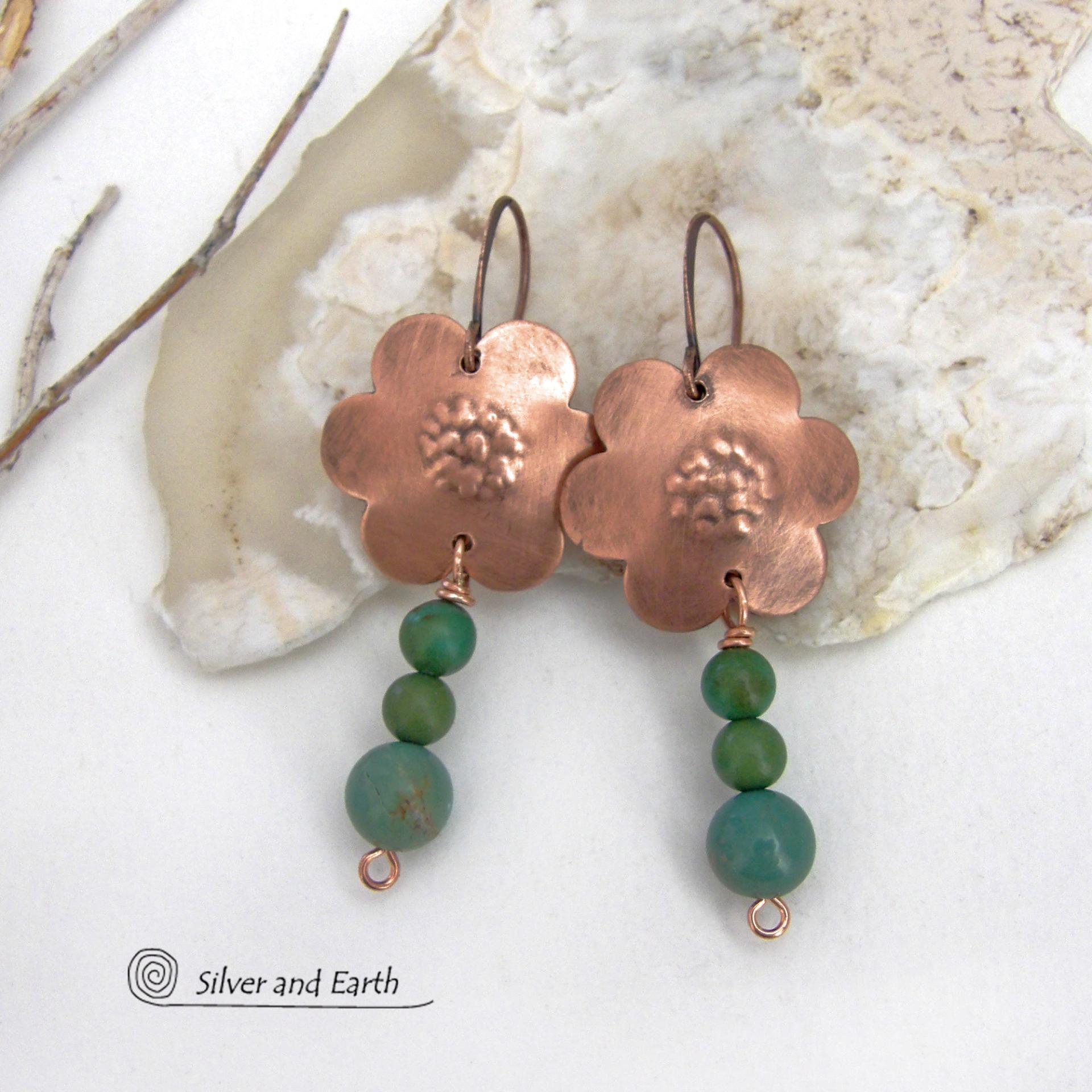 These hand forged copper flower earrings are accented with a stack of dangling turquoise stones. They have an earthy, whimsical charm and will make a great gift for nature / flower lovers and couples celebrating their seventh wedding anniversary. Copper is the traditional choice for this anniversary. Handmade in the USA by Silver and Earth Jewelry. 