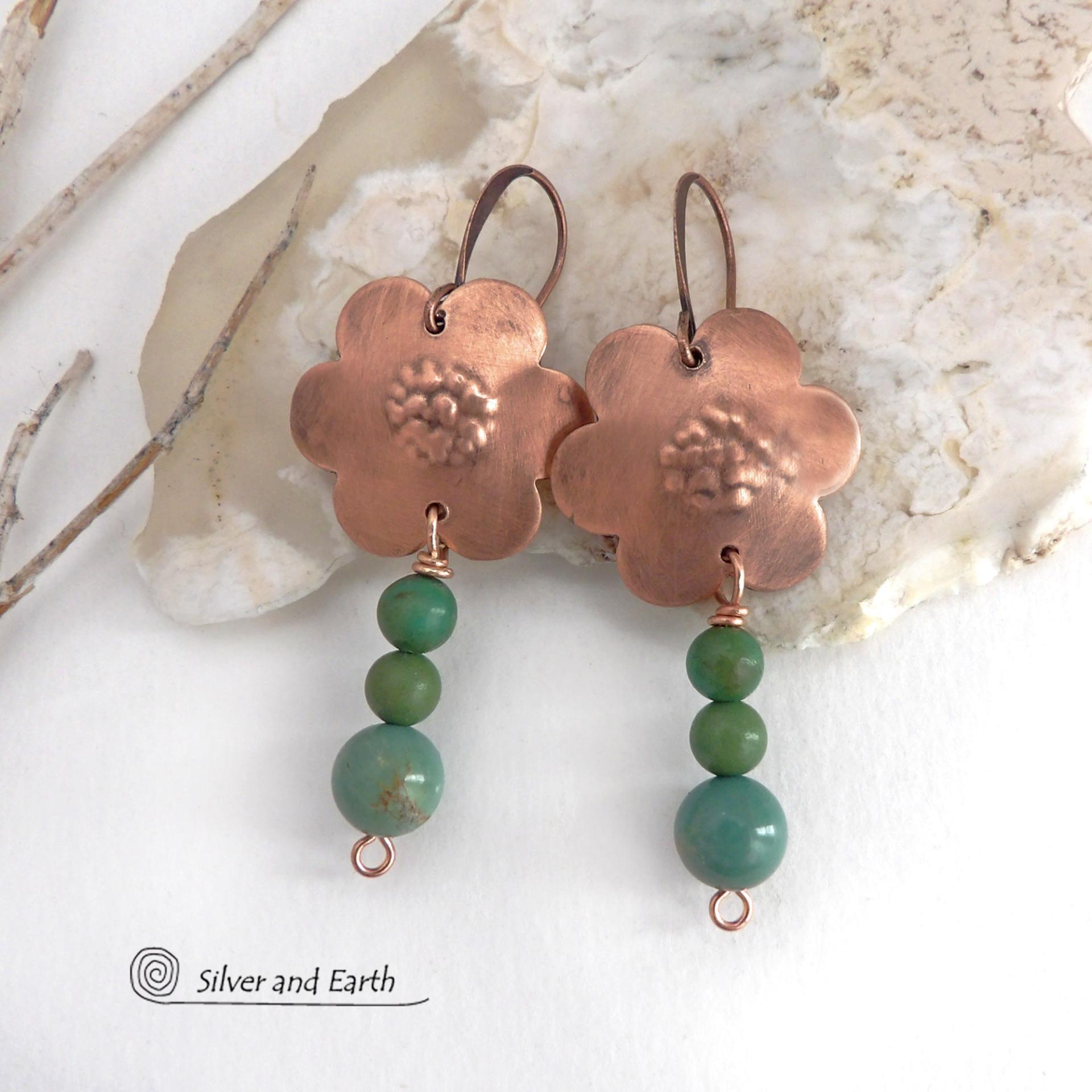 These hand forged copper flower earrings are accented with a stack of dangling turquoise stones. They have an earthy, whimsical charm and will make a great gift for nature / flower lovers and couples celebrating their seventh wedding anniversary. Copper is the traditional choice for this anniversary. Handmade in the USA by Silver and Earth Jewelry. 
