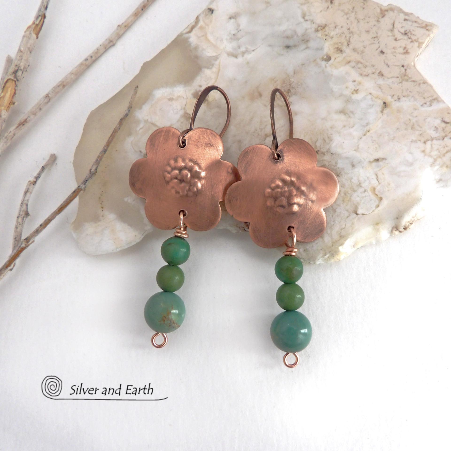 These hand forged copper flower earrings are accented with a stack of dangling turquoise stones. They have an earthy, whimsical charm and will make a great gift for nature / flower lovers and couples celebrating their seventh wedding anniversary. Copper is the traditional choice for this anniversary. Handmade in the USA by Silver and Earth Jewelry. 