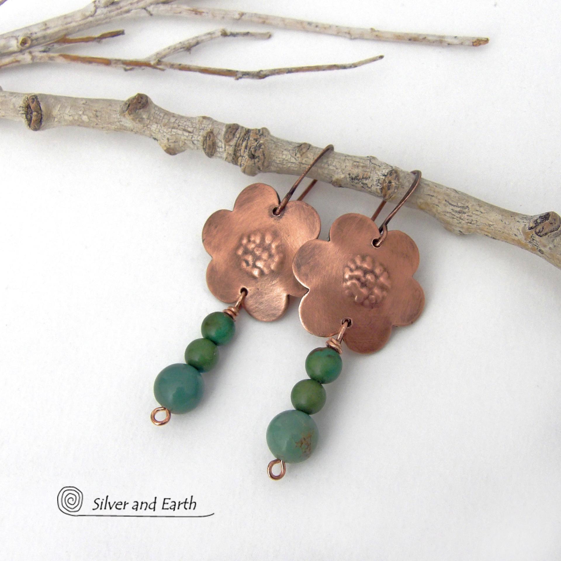 These hand forged copper flower earrings are accented with a stack of dangling turquoise stones. They have an earthy, whimsical charm and will make a great gift for nature / flower lovers and couples celebrating their seventh wedding anniversary. Copper is the traditional choice for this anniversary. Handmade in the USA by Silver and Earth Jewelry. 