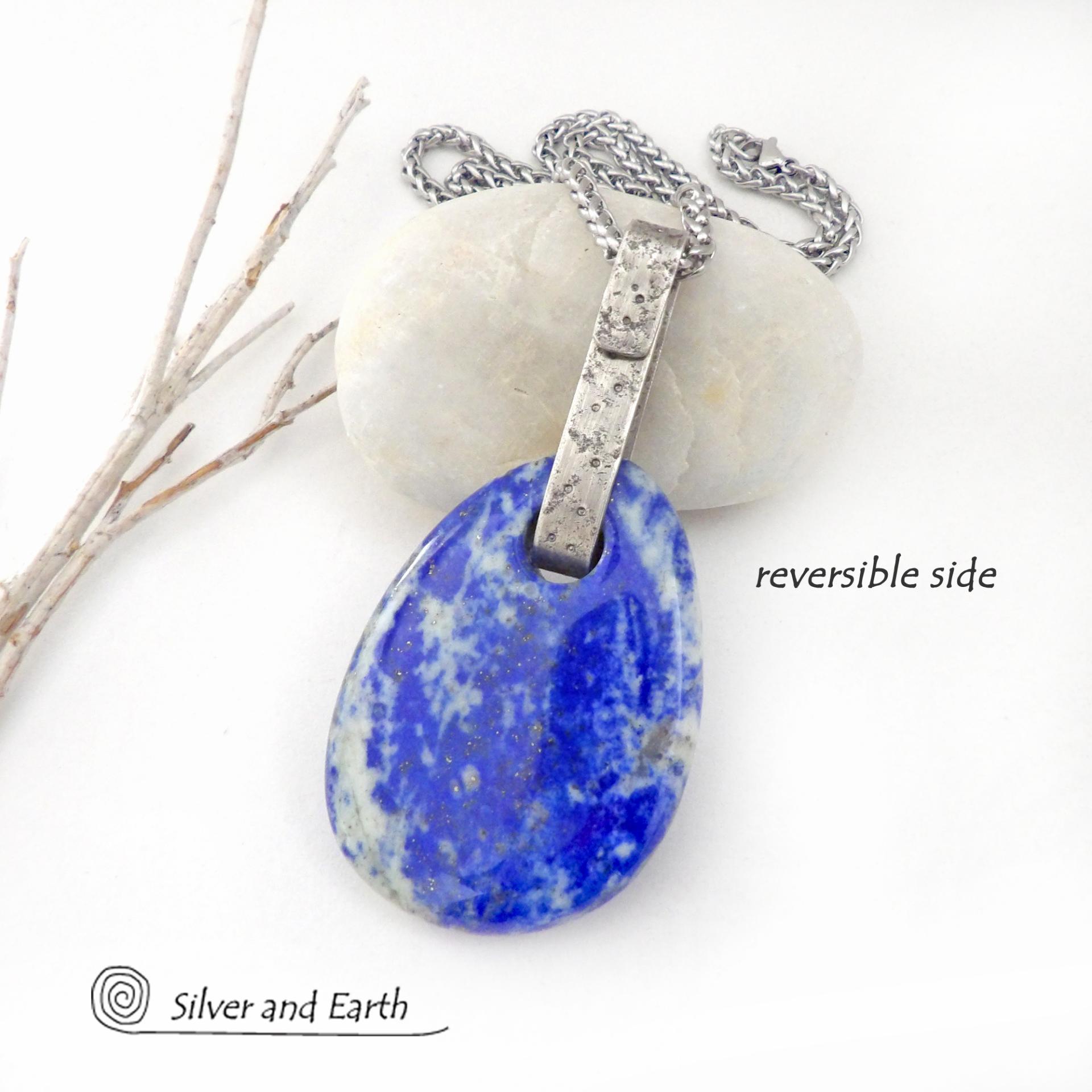This one-of-a-kind necklace features a gorgeous, natural lapis lazuli gemstone accented with a handcrafted sterling silver bail with a lightly hammered organic texture. The stone is a beautiful shade of blue with white inclusions, along with a sprinkling of natural sparkly pyrite inclusions. The stone is equally gorgeous on both sides, so I designed it to be reversible. (See all photos for alternate sides). Makes a great gift for a natural stone lover - or a nice addition to your own jewelry wardrobe.