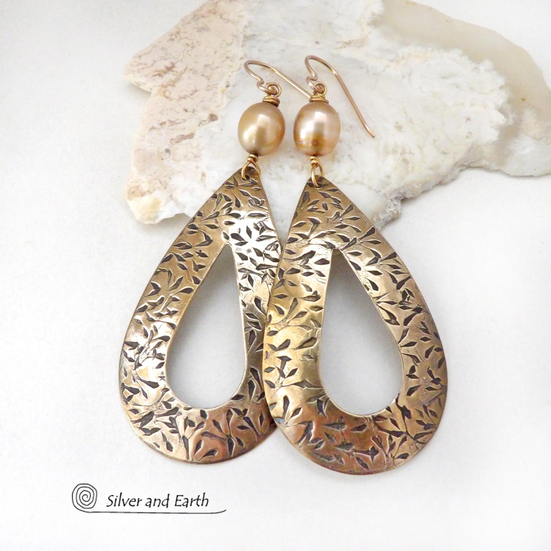 These gold brass hoop earrings have an intricate hand stamped texture and are accented with gold freshwater pearls. Big and bold, these earrings are a real statement piece and would be perfect for any occasion. 