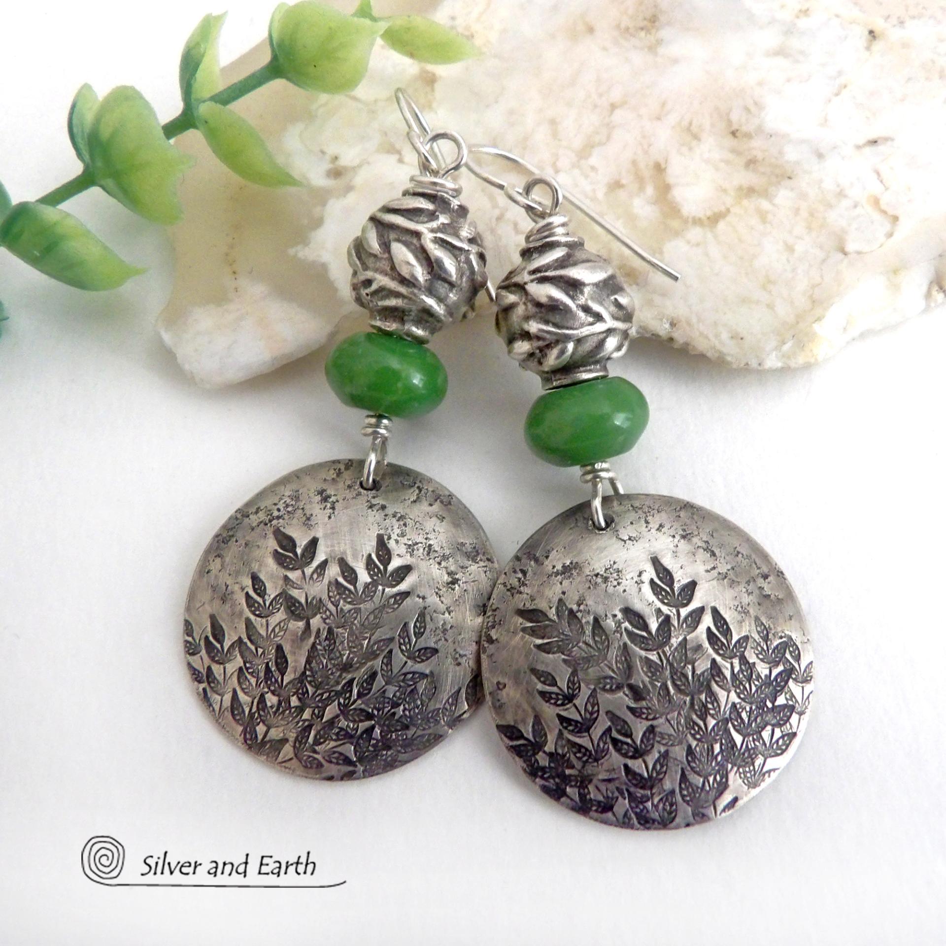Handcrafted sterling silver earrings with a gorgeous hand stamped leaf design accented with earthy green serpentine gemstones and pewter beads with a detailed 3-dimensional carved pattern of vines and leaves. They have a modern, earthy and elegant style and will make a great gift for a nature lover. Handmade in the USA by Silver and Earth Jewelry. 