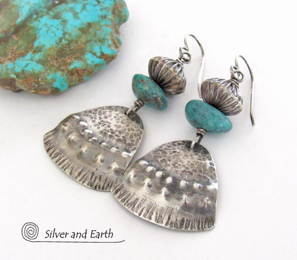 These handcrafted earrings feature uniquely textured sterling silver accented with natural turquoise gemstones and oxidized sterling silver beads with a rich, corrugated texture. They have a modern, southwestern tribal flair that makes a bold statement. Handmade in the USA by Silver and Earth Jewelry, a New Mexico True Certified business. 