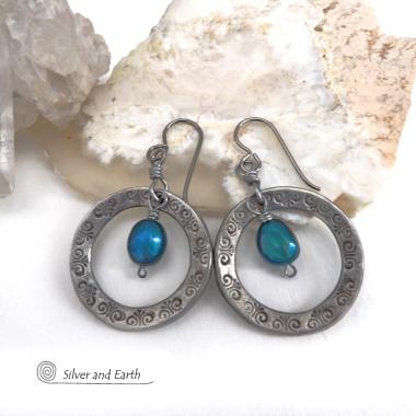 These handcrafted silver pewter hoop earrings have a hand stamped texture and are accented with beautiful blue freshwater pearls. They have a modern chic, classic style that is always in fashion and will coordinate beautifully with all wardrobe types. Makes a great gift for someone born in June. Pearl is the traditional gemstone for this month. Also makes a great wife gift for couples celebrating their 10th year of marriage. Pewter is the traditional metal for this occasion. Handmade in the USA by Silver an