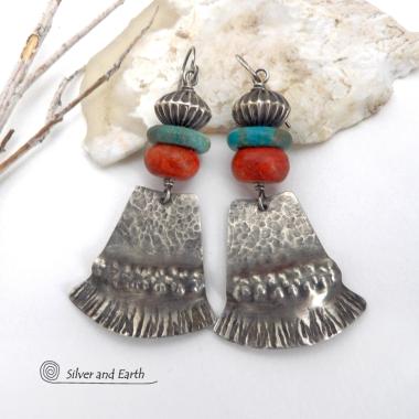 These handcrafted earrings feature hammered and hand stamped sterling silver dangles accented with a stack of natural turquoise stones, fossilized red coral and oxidized sterling silver Native style beads with a rich, corrugated texture. They have a modern, southwestern tribal flair that makes a bold statement. Perfect for women that love the southwest Santa Fe style and fashion. Handmade by Silver and Earth, a New Mexico True Certified business.  