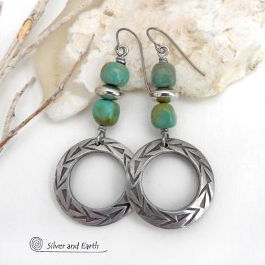 These handcrafted earrings feature silver pewter hoops with a hand stamped texture accented with natural, genuine turquoise stones and silver plated beads. Lightweight and comfortable to wear, they have an earthy modern style with southwest flair that coordinates beautifully with all wardrobe types. Handmade in the USA by Silver and Earth Jewelry, a Certified New Mexico True business.