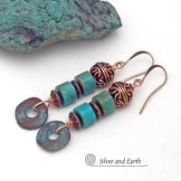 These handmade earrings feature natural turquoise stones accented with copper beads and organically shaped "rings" of copper with a soft turquoise patina finish. They have a modern chic bohemian style with a touch of exotic flair that makes a unique, bold statement. Handmade in the USA by Silver and Earth Jewelry.