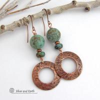  These handcrafted earrings feature round copper hoop dangles with a hand stamped texture accented with a stack of natural African turquoise stones and tiny copper beads. The stones have a pretty turquoise hue with an earthy natural black and brown matrix. These earrings have an earthy chic style with a modern bohemian flair that will coordinate beautifully with all wardrobe types. Handmade in the USA by Silver and Earth Jewelry.  Your choice of ear wires - copper or hypoallergenic niobium. 