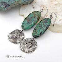Big, long natural African turquoise stones are accented with rustic hammered sterling silver dangles in these one-of-a-kind earrings. They have an earthy, organic style and are perfect for anyone that loves natural stones and unique handcrafted artisan jewelry. I hand sawed the dangles out of solid sterling silver sheet; hammered them for texture; crimped the edges for a ruffled effect; then added a few holes for a rustic vibe. Handmade in the USA by Silver and Earth Jewelry.