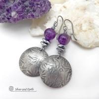 These handcrafted round silver pewter earrings have a hand stamped texture and are accented with purple amethyst and faceted hematite gemstones. The hematite has a natural sparkle and shine which gives these earrings an elegant, modern chic style that will look great dressed up or down. They'll coordinate beautifully with all wardrobe styles. Makes a great gift for someone with a February birthday - amethyst is that month's birthstone. Handmade in the USA by Silver and Earth Jewelry.