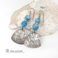 These handcrafted sterling silver dangle earrings have a hand stamped texture and are accented with natural apatite gemstones. The stones have a beautiful blue hue and the ones on top have a faceted nugget finish. They have an elegant, modern style that looks great with all wardrobe styles - dressed up or down.