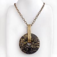 This one-of-a-kind pendant necklace features a stunning artistic jasper stone accented with a hand forged gold brass bail. This type of jasper is known for its intricate, natural patterns that resemble brushstrokes, landscapes, or abstract art. The stone in this piece has a natural bold dramatic pattern in hues of black and soft golden yellow with black streaks that resemble "feathery" dendrites. The design is modern and bold - yet classic and always in fashion. It can be worn by either a man or women. 