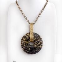 This one-of-a-kind pendant necklace features a stunning artistic jasper stone accented with a hand forged gold brass bail. This type of jasper is known for its intricate, natural patterns that resemble brushstrokes, landscapes, or abstract art. The stone in this piece has a natural bold dramatic pattern in hues of black and soft golden yellow with black streaks that resemble "feathery" dendrites. The design is modern and bold - yet classic and always in fashion. It can be worn by either a man or women. 