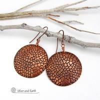 These handcrafted copper earrings have a beautifully detailed embossed cobblestone texture. Big and bold, they'll make a striking statement. Unique and versatile, they are lightweight and comfortable to wear and will look great with all wardrobe styles. Handmade in the USA by Silver and Earth Jewelry. Your choice of ear wire - copper or hypoallergenic niobium.
