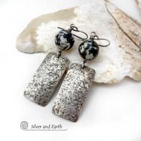These sterling silver earrings have an earthy, organic and modern contemporary flair. They feature handcrafted sterling silver rectangles with a rustic hammered texture accented with round chunky agate gemstones. The stones have a striking natural matrix of white, gray and black speckles which create a granite-like effect. Unique and one-of-a-kind, they'll make a great gift for women that love bold unique jewelry and natural stones. 