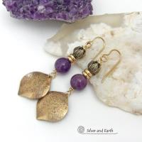 These handcrafted gold brass earrings have a hammered raw silk texture and are accented with natural purple amethyst gemstones, tiny brass beads and tulip flower-shaped brass beads. They have a modern elegant chic style that coordinates beautifully with all wardrobe types - dressed up or down. Makes a great gift for someone with a February birthday - amethyst is that month's birthstone. Handmade in the USA by Silver and Earth Jewelry. 
