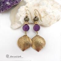 These handcrafted gold brass earrings have a hammered raw silk texture and are accented with natural purple amethyst gemstones, tiny brass beads and tulip flower-shaped brass beads. They have a modern elegant chic style that coordinates beautifully with all wardrobe types - dressed up or down. Makes a great gift for someone with a February birthday - amethyst is that month's birthstone. Handmade in the USA by Silver and Earth Jewelry. 