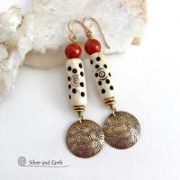 These handcrafted earrings feature a carved African bone beads, red jasper gemstones and textured gold brass dangles. Unique and striking, they have a boho chic style with lots of tribal flair. Perfect for women that love to wear bold unique artisan handmade jewelry. Handmade in the USA by Silver and Earth Jewelry. 