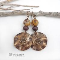 These earrings feature hand-forged bronze metal dangles accented with natural jasper stones and bronze glass beads. They have an earthy, modern boho feel that makes a striking statement. Perfect for women that love unique artisan handcrafted jewelry, earthy hammered textures and natural stones. Handmade in the USA by Silver and Earth Jewelry.
