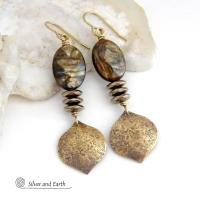 These handcrafted earrings feature gold brass dangles with a hammered organic texture accented with natural brown mica gemstones and faceted hematite stones with an electroplated champagne gold finish. The stones have a beautiful brown hue with undertones of shimmery gold and a faceted finish which casts off a natural sparkle and shine. They have a modern, chic and elegant style that coordinates beautifully with all wardrobe types - dressed up or down.