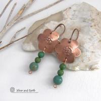 These hand forged copper flower earrings are accented with a stack of dangling turquoise stones. They have an earthy, whimsical charm and will make a great gift for nature / flower lovers and couples celebrating their seventh wedding anniversary. Copper is the traditional choice for this anniversary. Handmade in the USA by Silver and Earth Jewelry. 