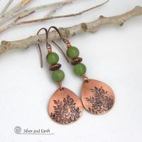 These handcrafted earrings feature teardrop shaped copper dangles with a hand-stamped leaf texture accented with natural green jade gemstones and copper beads. They have an earthy, modern style that coordinates well with all wardrobe styles. They'll make a great gift for a nature lover - or a nice addition to your own jewelry wardrobe. Your choice of copper ear wires or niobium hypoallergenic ear wires. Earrings are handmade in the USA by Silver and Earth Jewelry. 