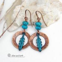 These handcrafted earrings feature round copper hoops with a hammered texture accented with a stack of turquoise beads and patina blue verdigris feathers. Lightweight and comfortable to wear - they'll add a touch of boho southwestern style to your wardrobe. Handmade in the USA by Silver and Earth Jewelry. 