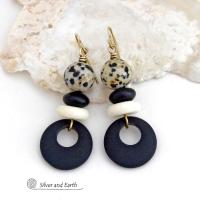 These handcrafted earrings feature matte black glass circle hoops accented with Dalmatian jasper gemstones, African bone and black glass beads. Unique and fun to wear, they have an earthy natural style with boho chic flair that makes a striking statement. They'll make a great gift for a natural stone lover - or a nice addition to your own jewelry wardrobe. 