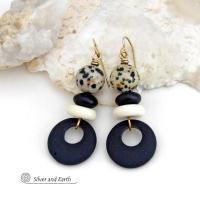These handcrafted earrings feature matte black glass circle hoops accented with Dalmatian jasper gemstones, African bone and black glass beads. Unique and fun to wear, they have an earthy natural style with boho chic flair that makes a striking statement. They'll make a great gift for a natural stone lover - or a nice addition to your own jewelry wardrobe. 