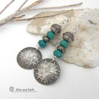 These sterling silver earrings have a southwest Santa Fe style and feature a stack of faceted blue turquoise gemstones and gray pyrite gemstones and are topped off with Native American made stamped sterling silver beads. Unique, bold and striking -- they're sure to make a statement. Perfect for anyone that loves southwest style jewelry. The earrings are handmade and are a beautiful example of southwest style jewelry. Handmade by Silver and Earth, a New Mexico True Certified business.