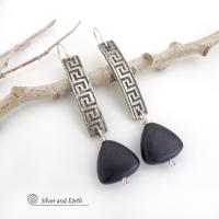These handcrafted sterling silver earrings have a Greek key pattern and are accented with triangular-shaped black onyx stones with a matte finish. They have a contemporary modern vibe that coordinates beautifully with all wardrobe styles.Bold and unique, these earrings are perfect for women that love unusual jewelry. Handmade by SilverandEarth Jewelry.