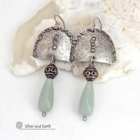 These unique sterling silver earrings have a funky bohemian tribal flair. They feature handcrafted sterling silver shapes with a hand textured design accented with natural green aventurine gemstones and vintage silver beads.