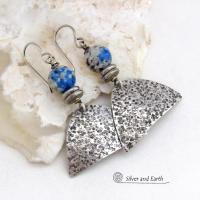 Handcrafted sterling silver earrings with rustic hammered sterling dangles accented with K2 granite gemstones. This unique, interesting stone has beautiful blue azurite inclusions within a black and white speckled granite base