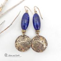 These handcrafted earrings feature beautiful long tube-shaped lapis lazuli gemstones accented with hammered gold brass dangles and tiny brass beads. The stones are a beautiful rich shade of blue with a sprinkling of natural sparkly pyrite inclusions. They have a modern, earthy chic elegance and can be worn with a variety of outfits - dressed up or down. Silver and Earth is a small business that makes beautiful handmade jewelry with high-quality natural materials. 
