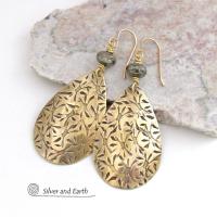 These handcrafted gold brass teardrop earrings have a hand stamped texture and are accented with natural silver pyrite gemstone beads. They have a modern contemporary style that coordinates beautifully with all wardrobe types.  MEASUREMENTS: Total length: 2-3/8” from top of bronze ear wires and 1” at widest point. Created out of solid gold brass; the shapes were hand stamped for texture; oxidized to enhance the detail. Handmade in the USA by Silver and Earth Jewelry.