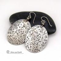 These large sterling silver dangle earrings have a modern, contemporary feel. Perfect "go to" earrings that can be worn everyday with all wardrobe types.