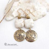 These gold brass dangle earrings have a unique hand textured design and are accented with creamy white magnesite stones. The stones have a natural matrix of golden-brown speckled inclusions and are topped off with tiny brass beads. I created the dangles out of solid gold brass sheet; and then created the texture which reminds me of the golden rays of the sun. The metal was oxidized to enhance the detail; then sealed with jeweler's wax to resist tarnishing.