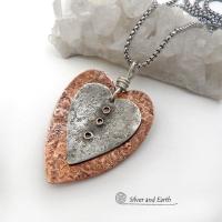 This mixed metal heart necklace has an earthy, rustic charm and will make a great gift for someone special. It features nesting hearts handcrafted from sterling silver and copper. It comes on a 20" stainless steel chain with lobster claw closure. The necklace holds a special significance as it represents two hearts coming together in union. This could be a meaningful gift for someone you love deeply.  The perfect gift for a wife, mom or girlfriend. Makes a great gift for couples celebrating their 7th weddin